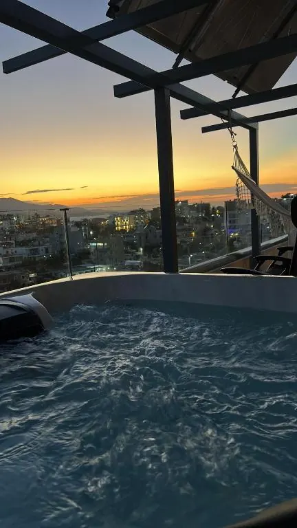 Rooftop hot tub at sunset