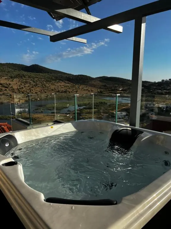 Private rooftop hot tub with a mountain view